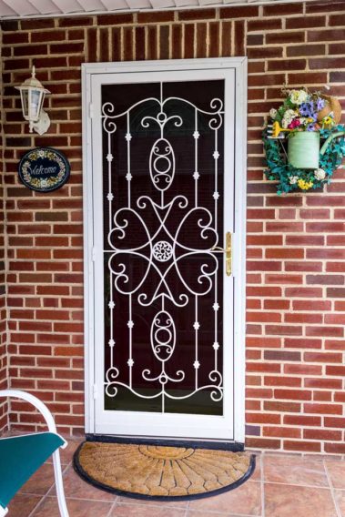white security door on brick house