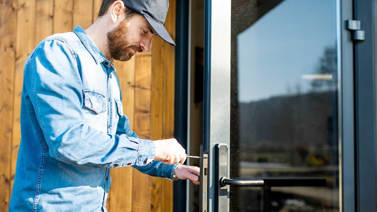 man installing a security door