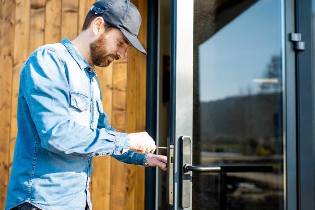 Types of Security Doors man installing a security door