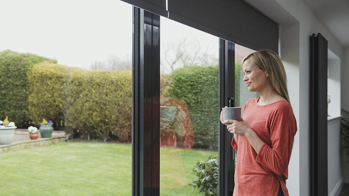 a woman experiencing the benefits of patio doors