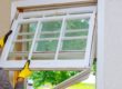 a person deciding that they do need window replacement