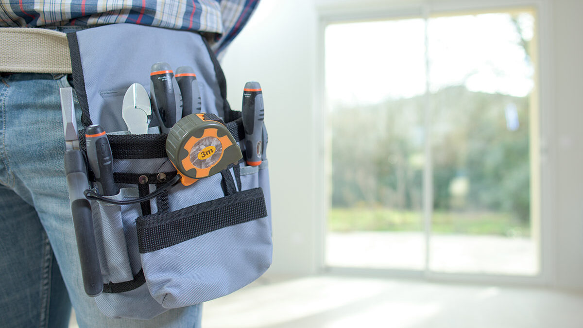 Best Energy Efficient Doors (1) man installs energy efficient doors