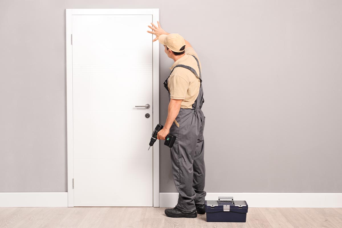 Are FIberglass Doors a Good Idea man installs a fiberglass door