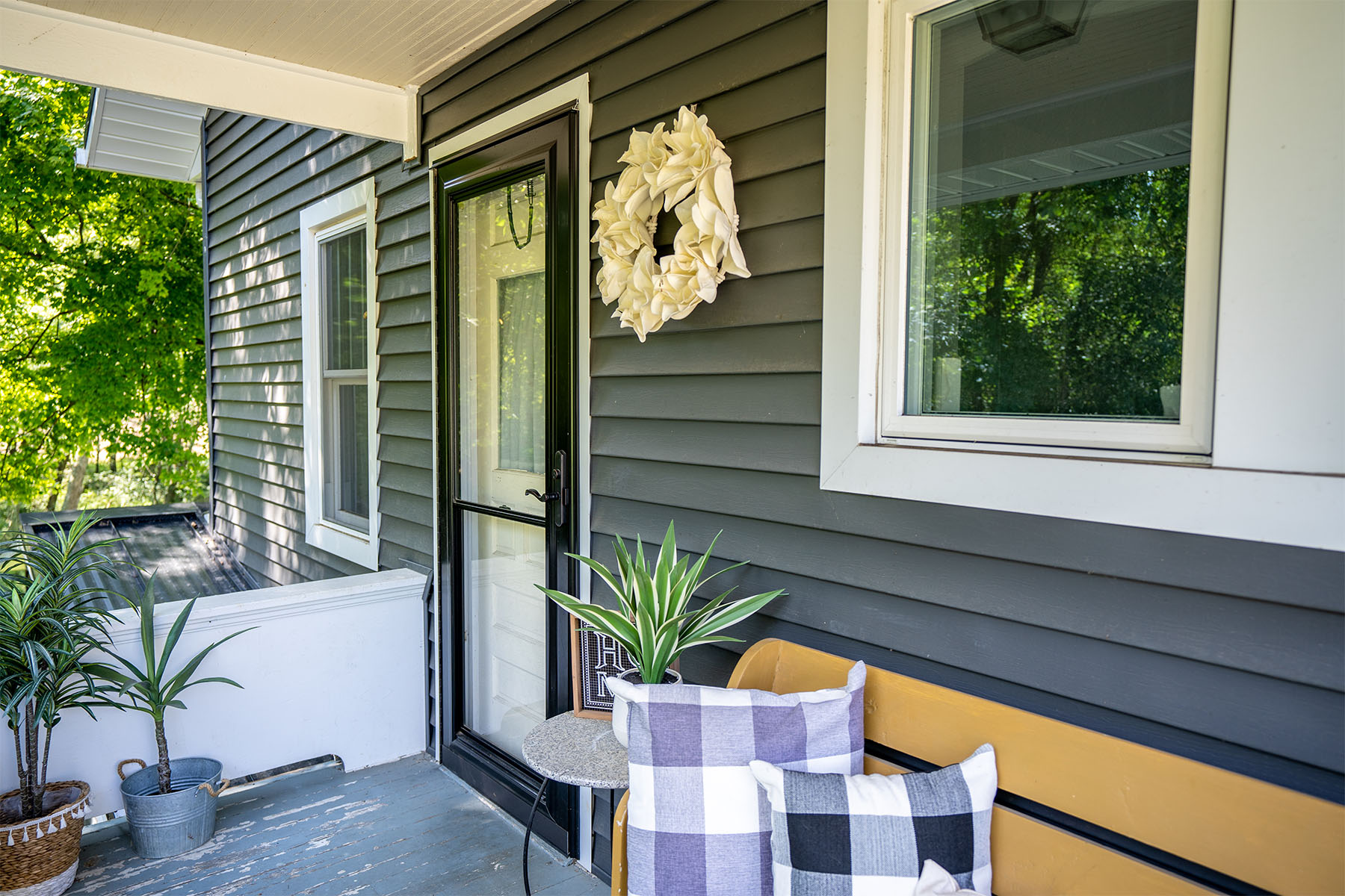 4 Ways to Remove Rust from Metal Doors Massterseal Image Side view of rust-free metal storm door on neatly decorated porch