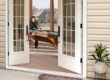 A french door connecting a patio to a game room