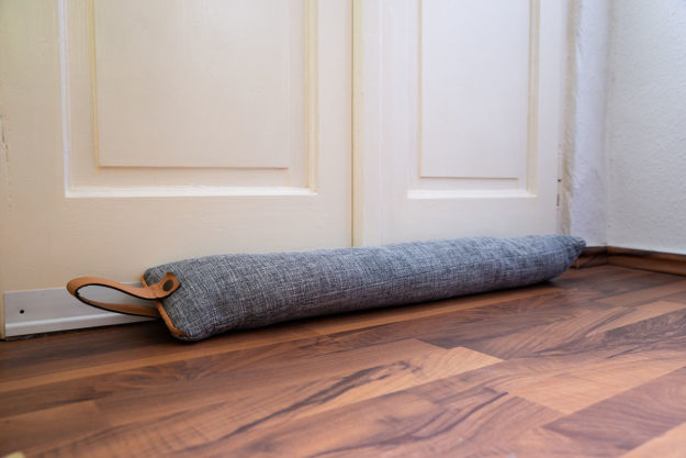 3 Easy Steps to Fix a Drafty Door a picture of a door jam to fix a drafty door