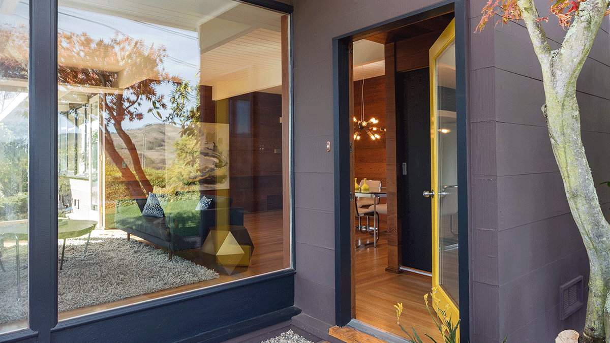 a beautiful front entryway door with steel and glass is open to a beautiful home showing off Steel Entry Doors With Glass