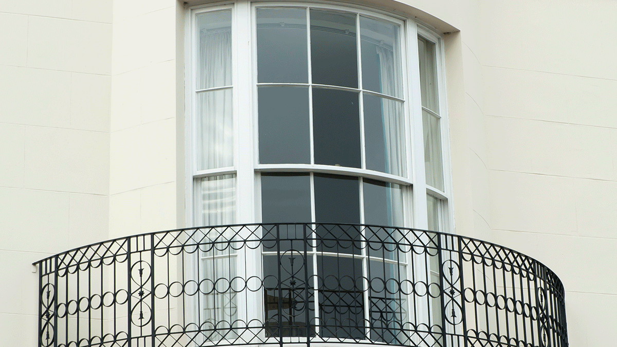 a picture of a rounded bow window to demonstrate window treatments for bow windows