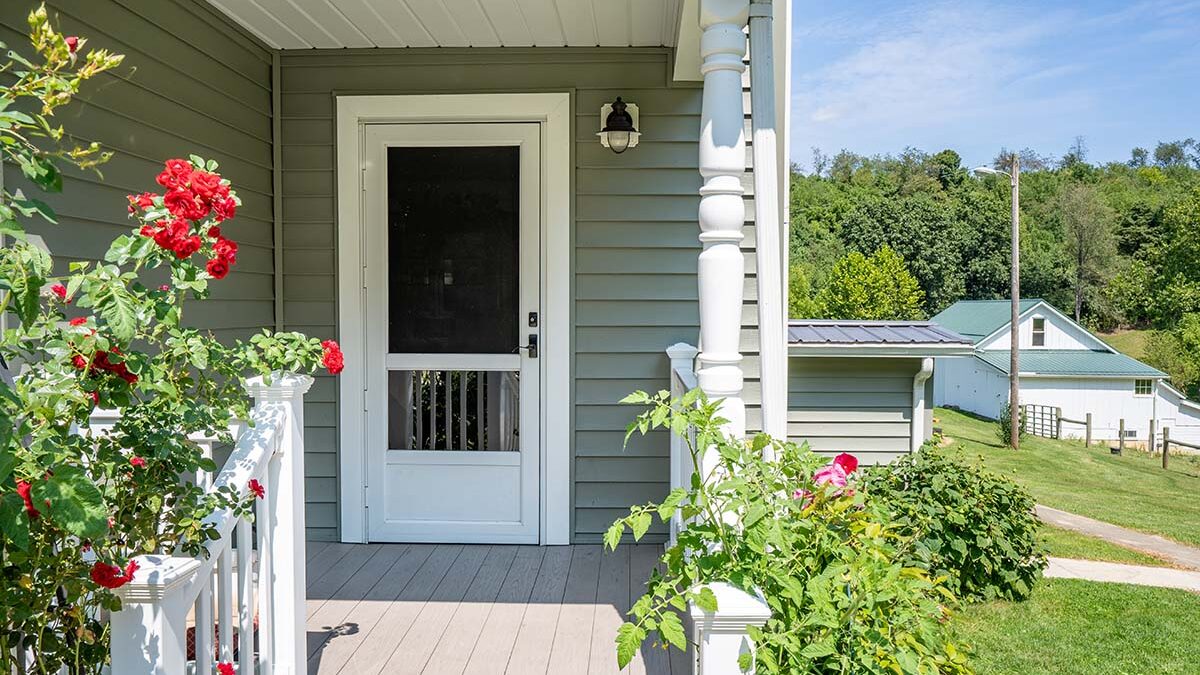 front facade of home with energy efficient storm door