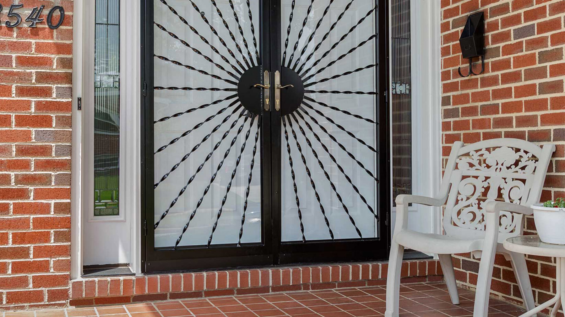 Double front door with decorative storm door