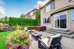 view of yard house and sliding patio doors