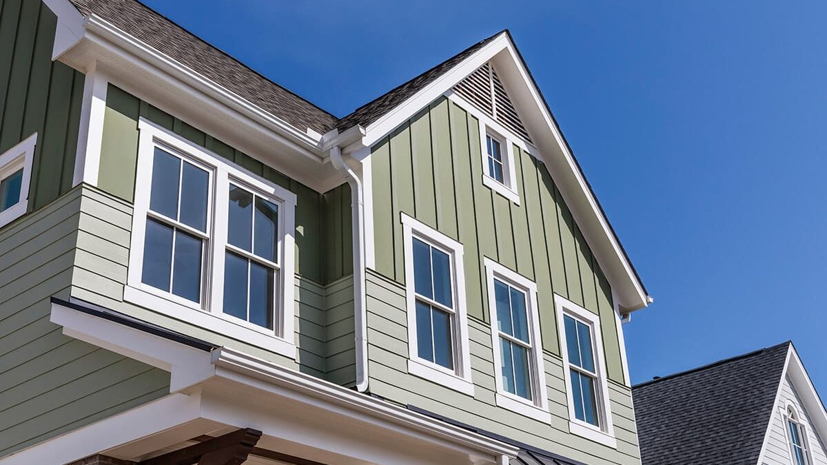 5 Benefits of Professional Window Installation vs DIY front facade of two story house with newly installed windows