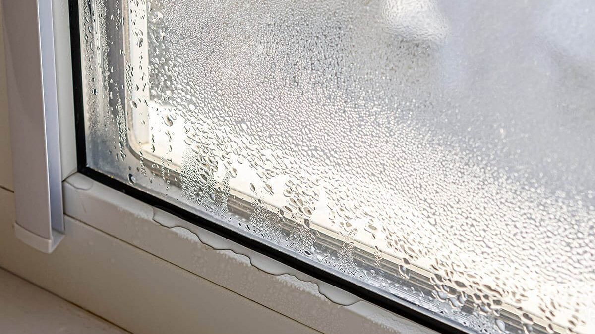 close up image of leaking window pane in winter