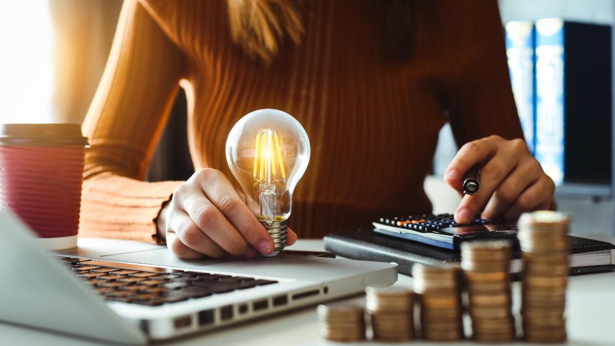 a woman researches how to cut down on her energy costs