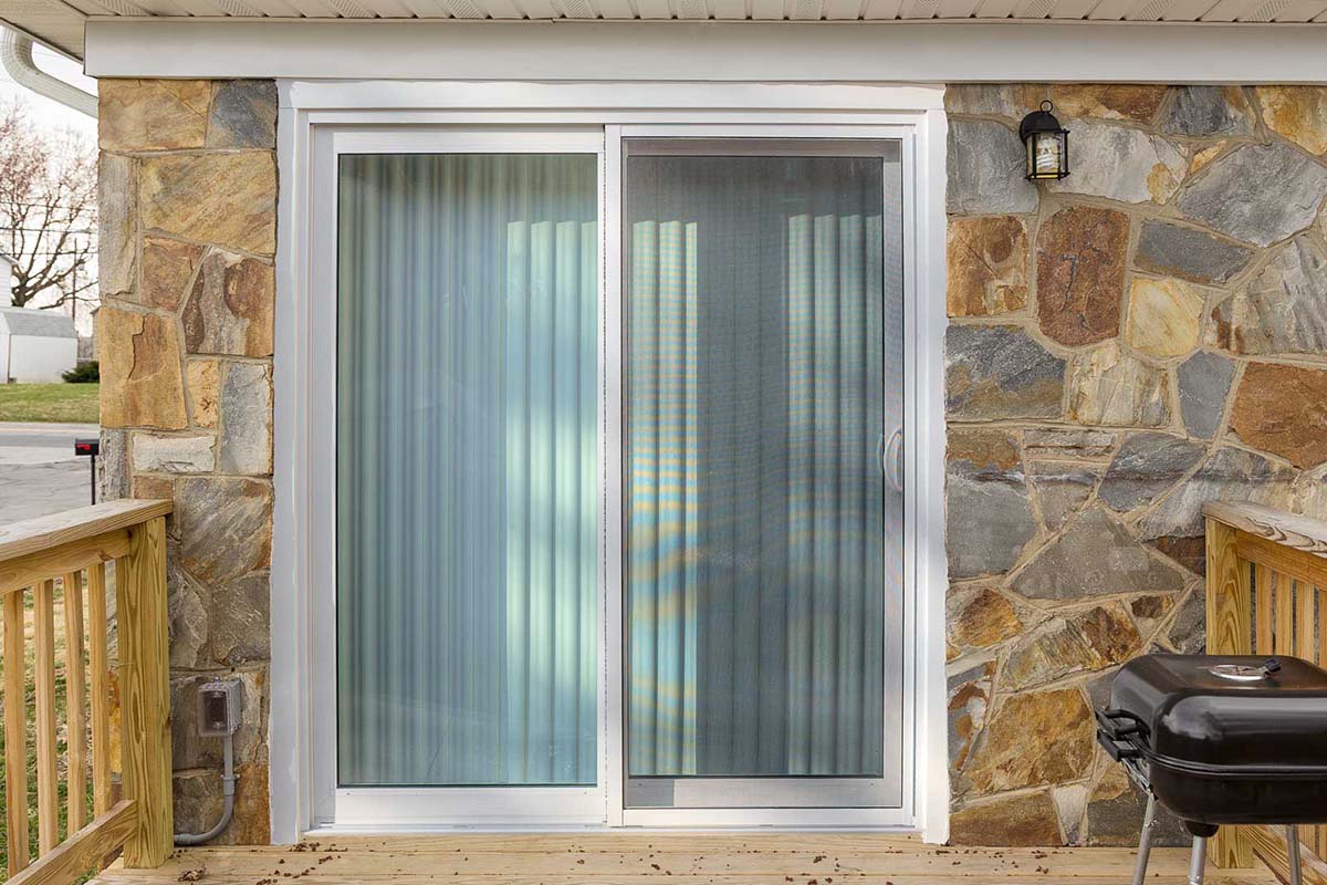French Doors vs. Sliding Doors—Which Is the One for You a homeowner has had a sliding glass patio door installed