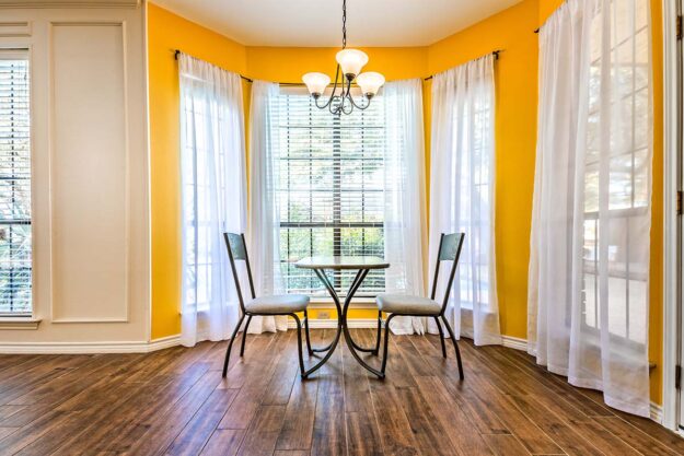 a kitchen bay window brightens up a breakfast nook
