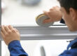 a professional installer seals a new window