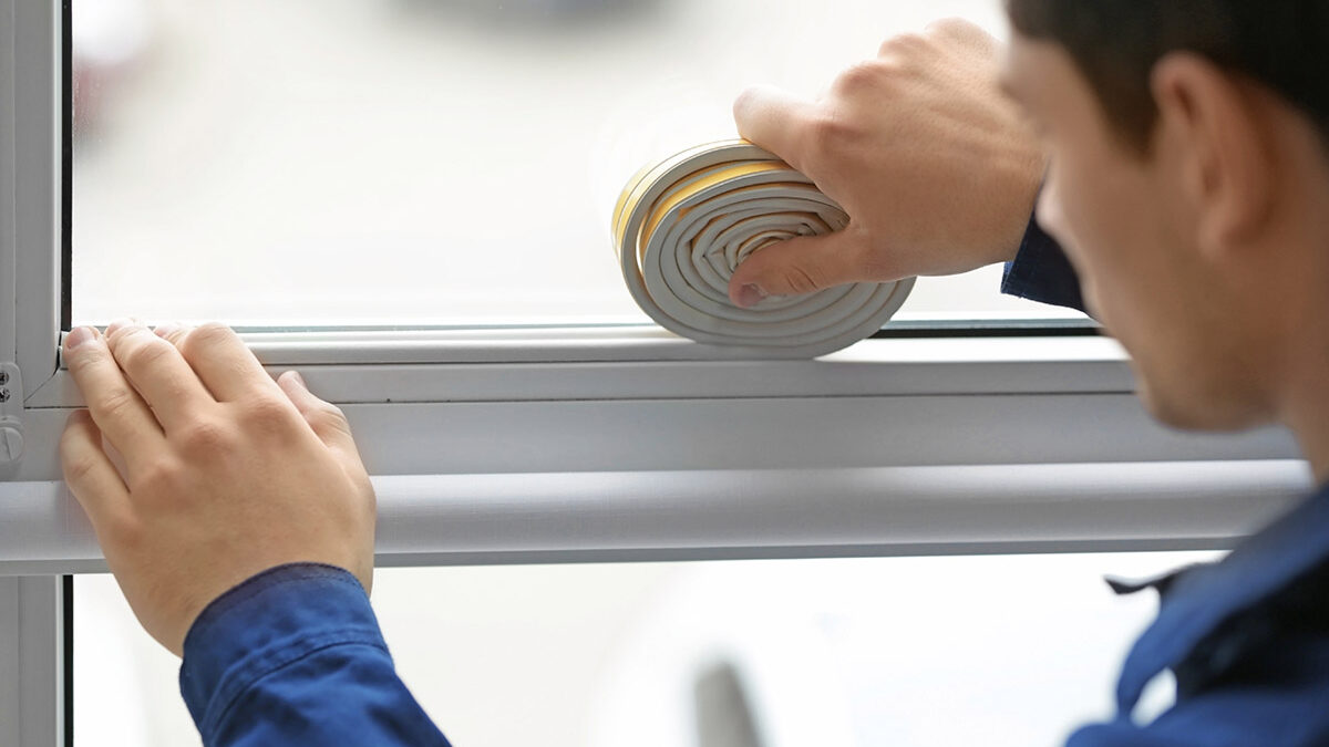 a professional installer seals a new window
