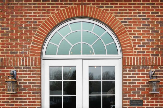 Half Circle Windows- Stylish Choices for Your Home a newly installed half circle window above an entryway