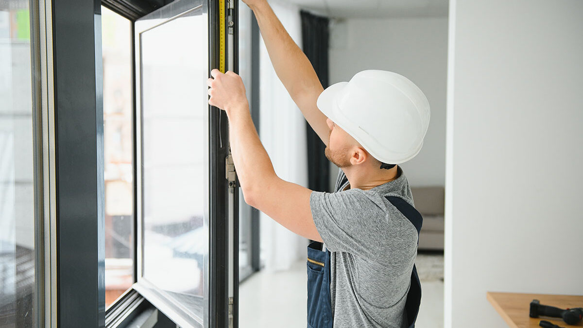 a professional installs new windows