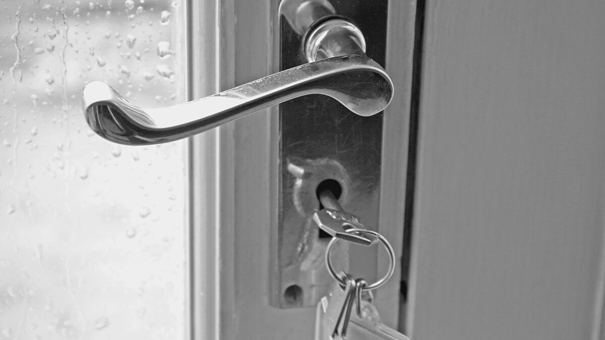 keys in the lock of a new security door