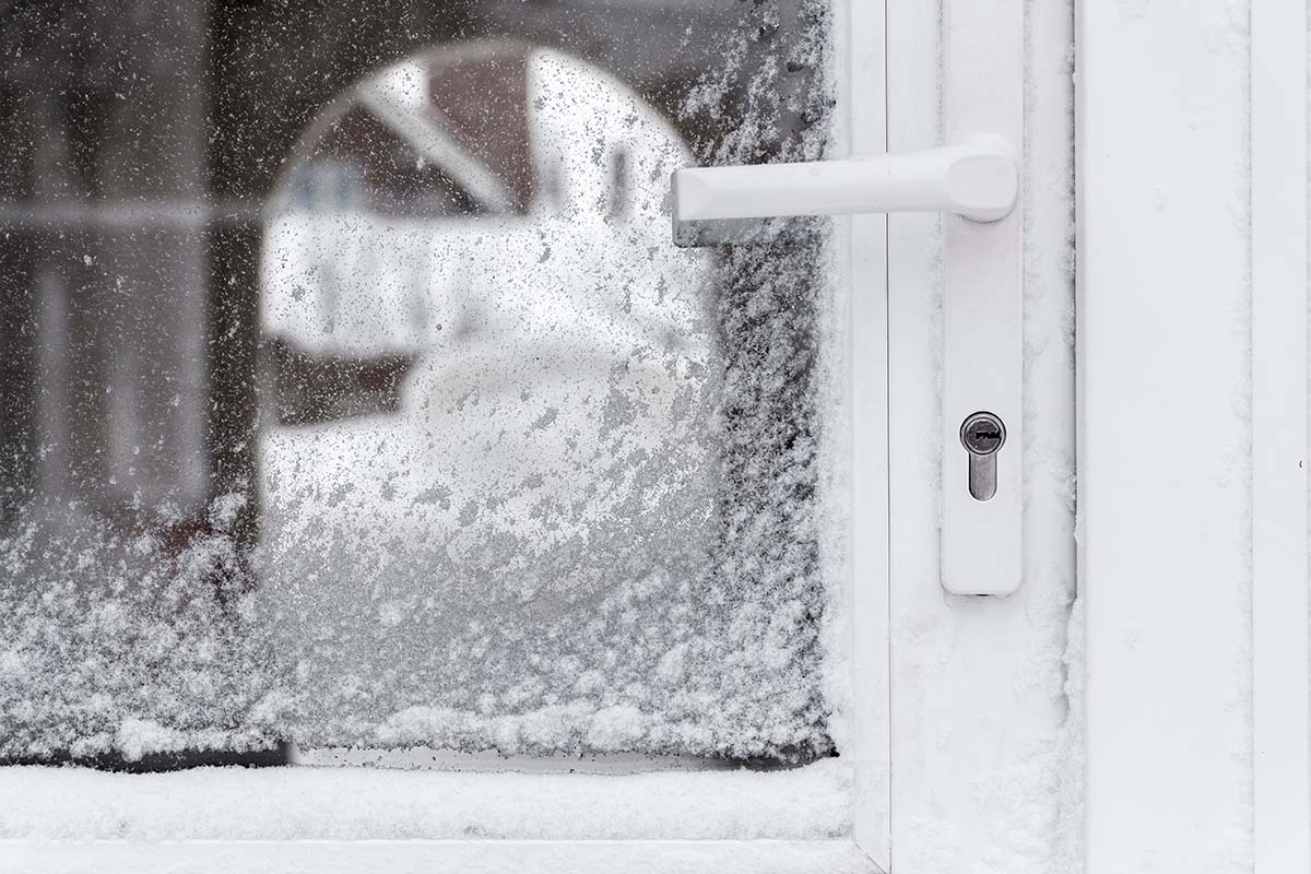 How to Weather Seal Your Front Door a weather sealed front and storm door in the snow