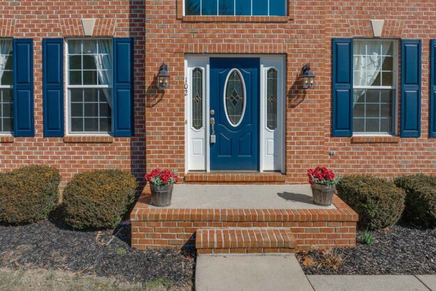 5 Benefits Of Fiberglass Entry Door Installation a newly installed fiberglass entry door on a home