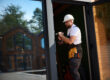 a professional installs a new storm door