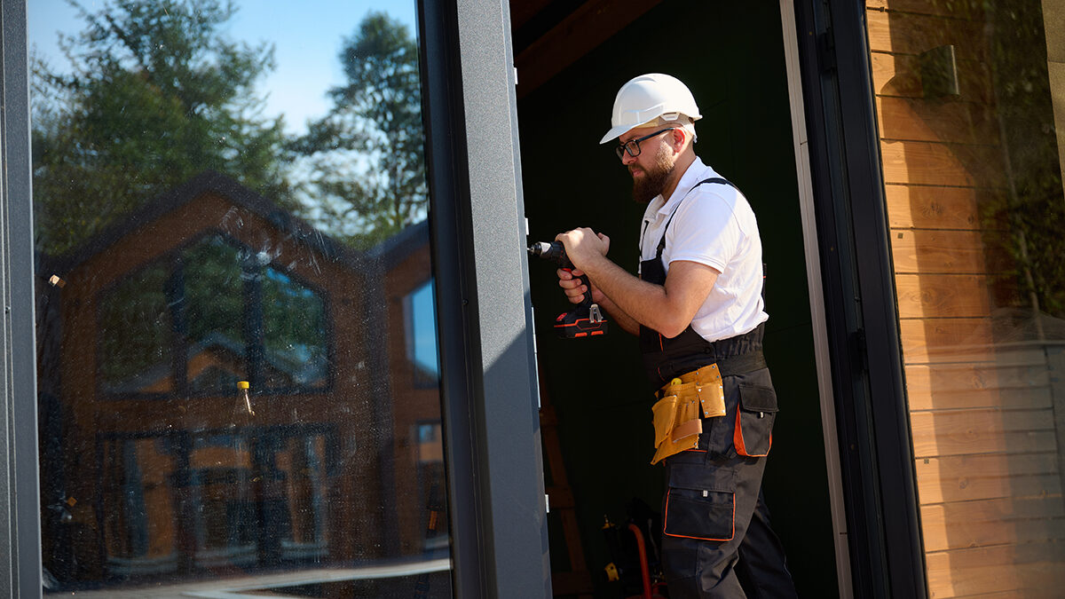 a professional installs a new storm door