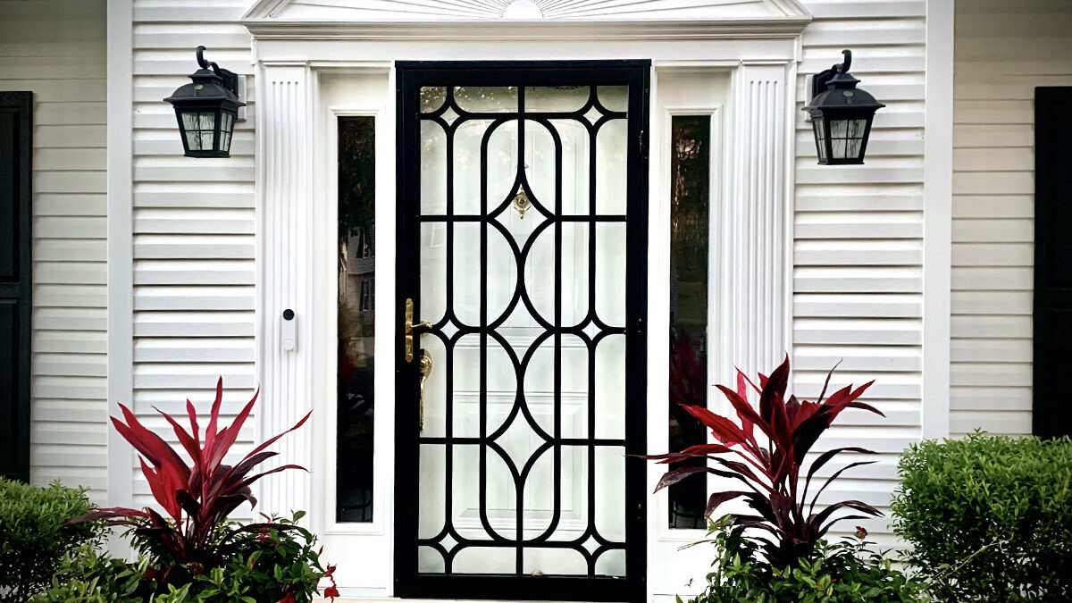 Storm Door Hardware Trends for 2026 Image 3 Example of a storm door with gold hardware